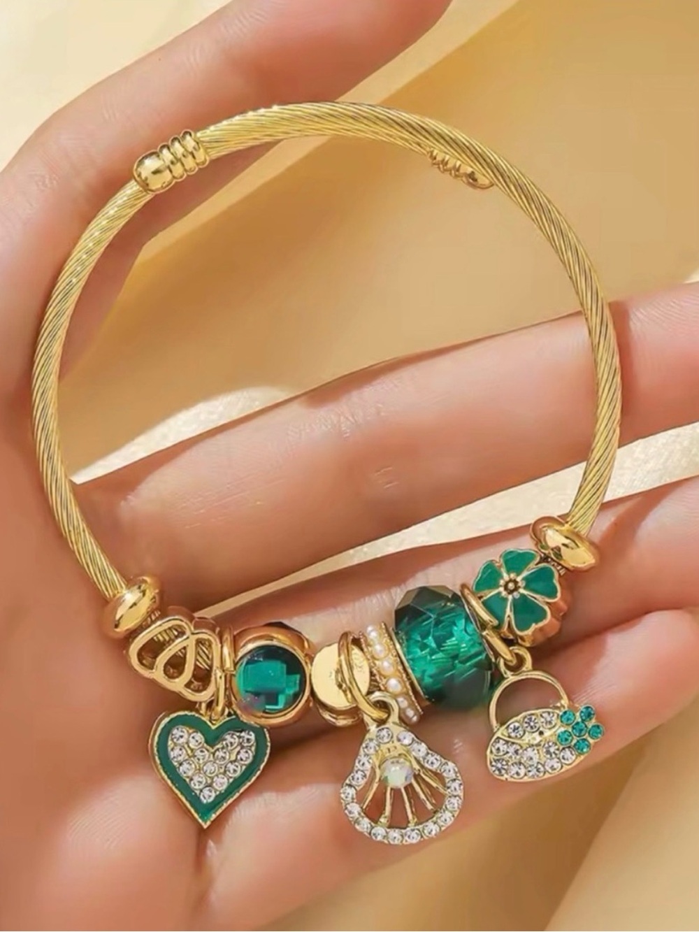 Gold-Tone Green Charm Bracelet with Crystal Accents